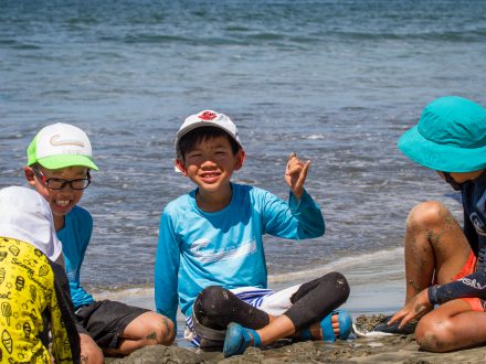 little kids having fun on beach